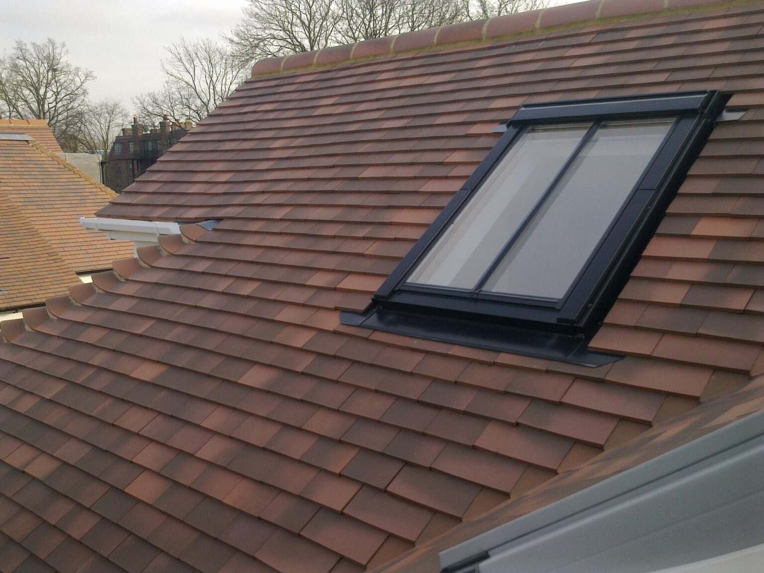 Finished tiled London roof with rooflight